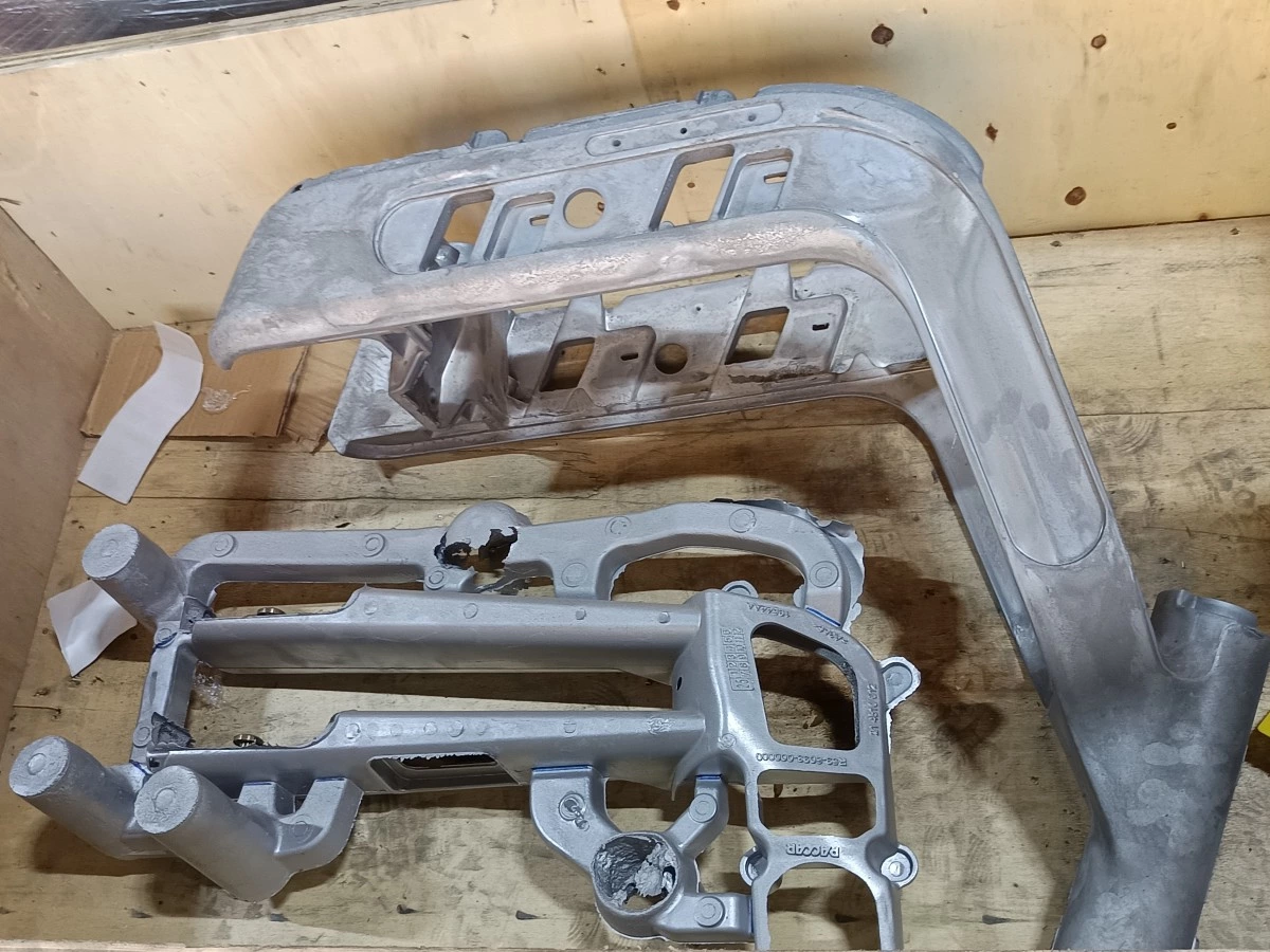 Flash along the parting line of an aluminum die casting