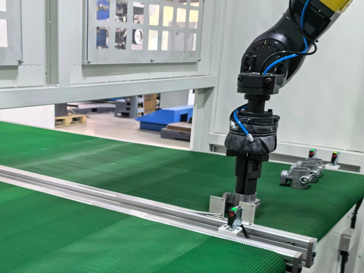 Custom gripper holding a metal workpiece for robotic polishing